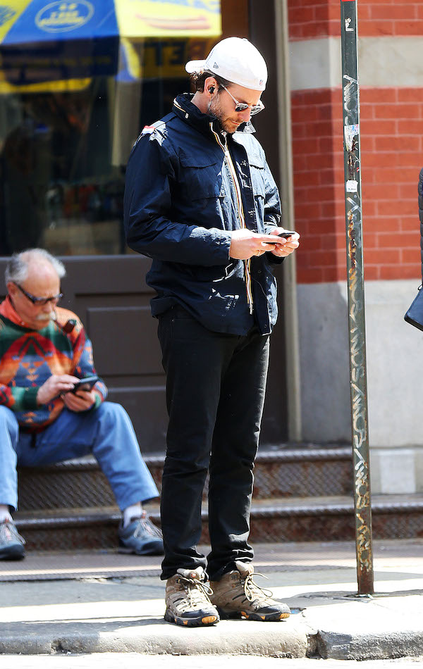 Dlisted | Bradley Cooper checks his phone as he walks in SoHo, NYC