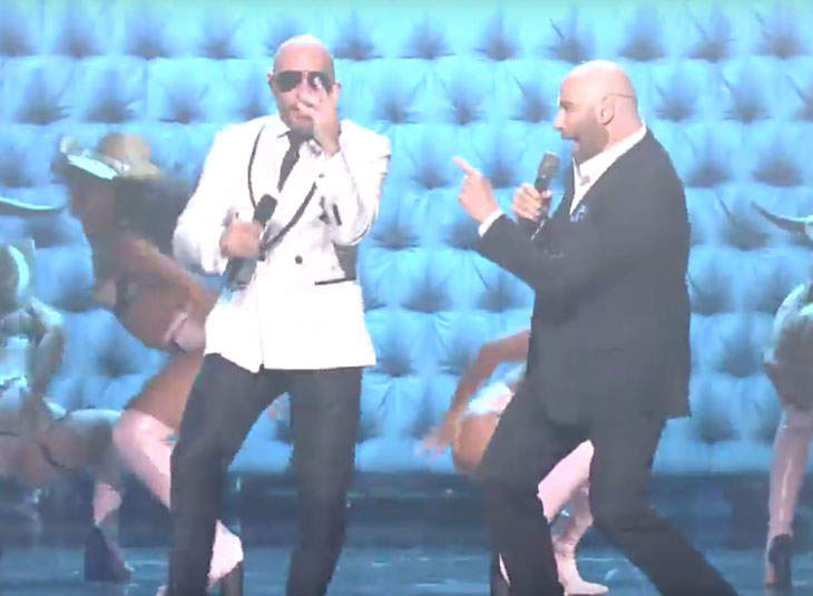 John Travolta Cut A Rug With Pitbull On Stage At The Premio Lo Nuestro Awards