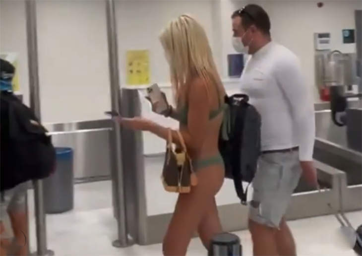 Open Post: Hosted By The Woman At The Airport In A Mask And A Bikini